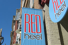 Red Heel Shoe store banner sign in the 3rd Ward Milwaukee, WI